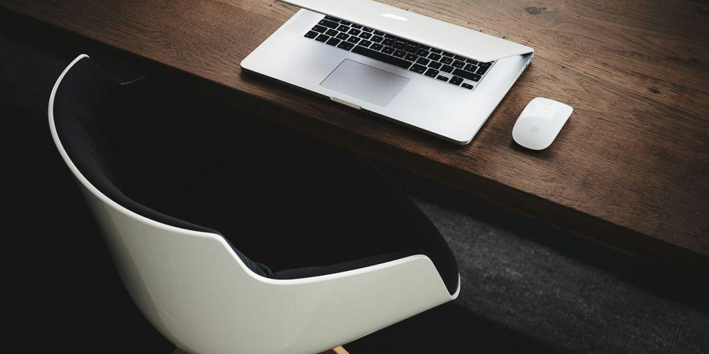 Apple Macbook Beside Computer Mouse on Table