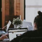 Selective Focus Photography of People Sits in Front of Table Inside Room